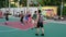 Shenzhen, China: men play basketball as a fitness sport