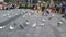 Shenzhen, China: pigeons in the square, people are watching. These pigeons are trained and people watch them for free, but to feed