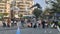 Shenzhen, China: pigeons in the square, people are watching. These pigeons are trained and people watch them for free, but to feed