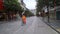 Shenzhen, China: prevent and combat new coronavirus pneumonia, street view, a small number of pedestrians, all wearing masks, and