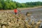 Shenzhen, China: tourists play on the beach or catch crabs and enjoy their leisure time