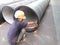 Shenzhen, China: workers are installing a giant pipe