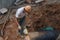 Shenzhen, China: Workers installing water pipes