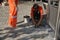 Shenzhen, China: workers in pavement repairing