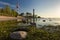 Shepelevsky lighthouse at the tip of the Karavaldai peninsula in the Leningrad region on a summer evening at sunset