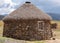 Shepherd`s mud hut in the hills near the town of Mokhotlong in north eastern Lesotho, Africa.