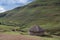 Shepherd`s mud hut in the hills near the town of Mokhotlong in north eastern Lesotho, Africa.