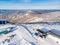 Sheregesh Kemerovo region ski resort in winter, landscape on mountain and hotels, aerial top view