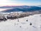 Sheregesh Kemerovo region ski resort in winter, landscape on mountain and hotels, aerial top view