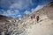 The sherpa porters carrying heavy sacks in the Himalayas