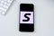 Sherpa Scooters app logo on a smartphone screen.