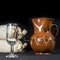 Sherry glass beside a pottery jug to serve wine