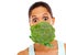 Shes behind broccoli. Portrait of an attractive young woman with a head of broccoli floating in front of her mouth.