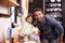 Shes daddys little helper. A cute little girl helping her dad make pancakes at home.