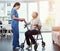 Shes dedicated to her patients. Full length shot of a young female nurse talking to her senior patient in the old age