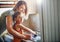 Shes always eager to help around the house. Portrait of a mother and her little daughter washing dishes together at home