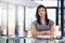 Shes the epitome of confidence. Cropped portrait of a young businesswoman standing with her arms folded in the office.