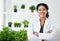 Shes an expert on the life processes of plants. Portrait of a female scientist standing in her lab.