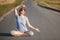 Shes found the road to overall wellbeing. Portrait of a woman looking excited while sitting in the lotus position on a