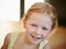 Shes always full of smiles. Cropped portrait of a cute little girl standing in her home.