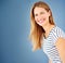 Shes got plenty of confidence. a young woman posing against a blue background.