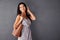 Shes got a purse packed with confidence. Studio portrait of an attractive young woman holding her handbag.