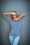 Shes got some cool moves. Studio shot of a young woman gesturing against a gray background.