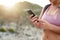 Shes got a strong connection even this far out. Closeup shot of an unrecognizable woman using her phone while out on a