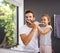 Shes learnt from the best. a handsome Dad and his daughter brushing their teeth in the bathroom at home.