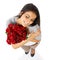 Shes so in love. A beautiful woman holding a bouquet of roses isolated on a white background.