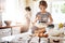 Shes Moms special little baker. a little girl having fun while baking with her mother in the kitchen.