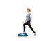 Shes passionate about her health. An attractive young woman toning her legs on a bosu-ball.
