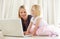 Shes pretty techno-savvy for such a young kid. Shot of a mother and daughter bonding while surfing the internet together