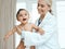 Shes so well-behaved when visiting the doctor. a paediatrician examining a baby in a clinic.