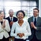 Shes worked hard for her accolades. Portrait of a succesful businesswoman being applauded by her colleagues in the