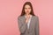 Shh, keep calm! Portrait of young woman in business suit keeping finger on lips making silence gesture