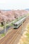 Shibata,Miyagi,Tohoku,Japan on April 12,2017: JR Tohoku line train and cherry trees along Shiroishi river banks in spring.