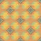 Shibori style ikat vector seamless vector pattern background. Scribbled diamond shapes backdrop in orange, pastel blue