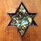 Shield of David or Star of David curved on wood