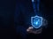 a shield lock icon is secure cyber technology in a smartphone. concept of fraud, privacy data protection, and safe information