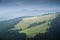 Shielings on a subalpine meadow on a slope of a mountain in the Carpathian mountains