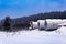 Shift camp with cylindrical portable buildings in the winter northern taiga