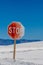 Shifting White Sand Slowly Taking Over Stop Sign