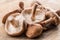 Shiitake mushrooms on the wooden background.