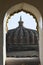 Shikhara carved in Stone masonry over Mandapam as seen from arched opening of balcony over main Gateway at Vitthal Temple, Palashi