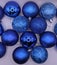 Shimmering Blue Christmas Ornaments on White Background