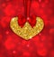 Shimmering Golden Heart with Red Ribbon