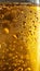 Shimmering golden liquid bubbles background with oil and sparkling golden droplets