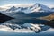 a shimmering lake reflecting a mountain range