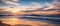 The shimmering waves reflect the warm hues of the setting sun creating a tranquil and breathtaking scene. Generative AI